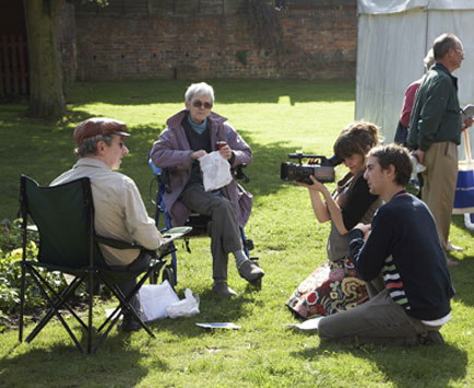 local residents sitting being videoed by Rogan